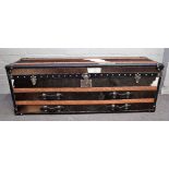 A 20th century cow hide and leather upholstered travelling trunk,