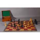An early 20th century Staunton style chess set and a folding board, (a.f.).
