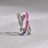 A diamond, ruby and sapphire set swingover and under eternity ring,