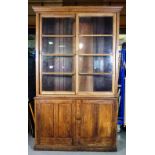 An 18th century oak bookcase with pair of cupboards, 137cm wide x 220cm high.