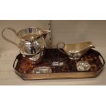 A group of plated wares, comprising, a shaped rectangular twin handled tray,