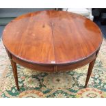 A 19th century French fruitwood oval dining table, on tapering fluted supports,