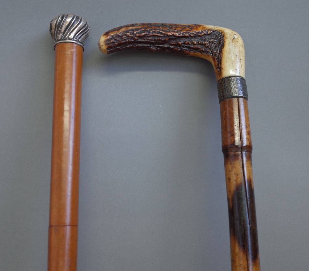 A Victorian malacca and silver mounted walking cane sword stick (88.