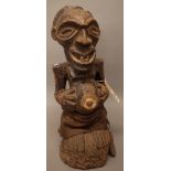 An African Songri Power figure, hardwood carved with rope and linen decoration, 54cm high.