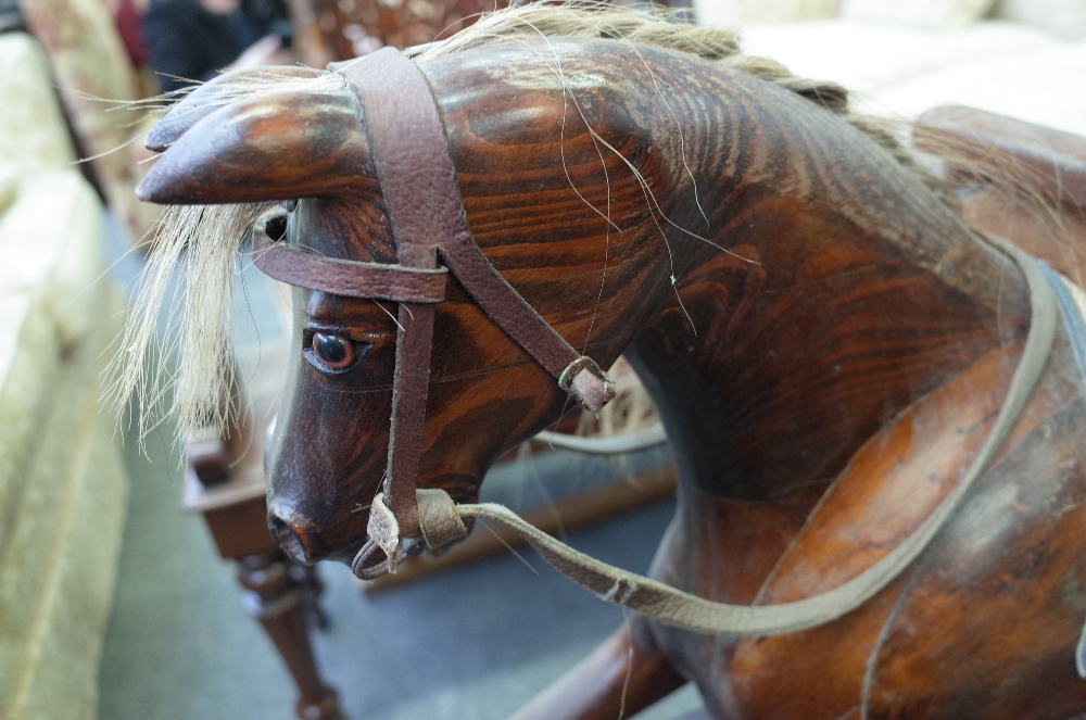 An early 20th century stained pine rocking horse on a wrought iron and stained pine swing frame - Image 2 of 7