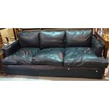 A 20th century hardwood framed three seater low sofa with black leather studded upholstery,
