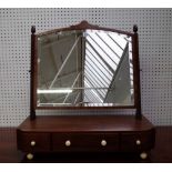 A large Regency inlaid mahogany toilet mirror with bow three drawer base, 74cm wide x 74cm high.