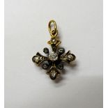 A diamond set small pendant cross,