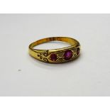 A gold, ruby and diamond ring,