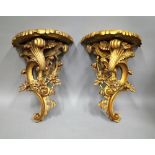 A pair of 20th century Rococo revival gilt 'C' scroll wall brackets, 35cm wide x 46cm high, (2).