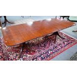 A Regency style mahogany D-end extending dining table, on eight downswept supports,