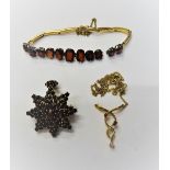 A garnet bracelet, in a sprung bar link design, detailed 585,