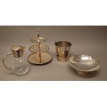 A group of plated wares, comprising; a three tier cake stand, a French fruit bowl of circular form,
