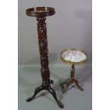 A 20th century carved mahogany torchere stand,