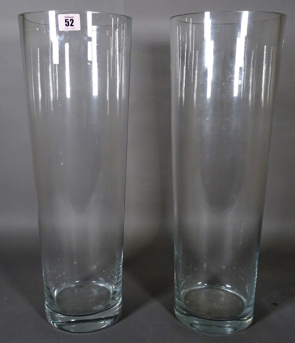 A pair of large 20th century clear glass tapering cylindrical bases, 53cm high.