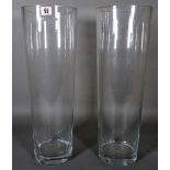 A pair of large 20th century clear glass tapering cylindrical bases, 53cm high.