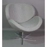 A 20th century grey upholstered Arne Jacobsen replica 'Swan' armchair on chrome base.