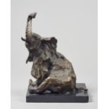 Untitled, seated bronze elephant, unsigned, on a polished black marble plinth, bronze 48.5cm high.