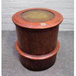 A Victorian mahogany circular lift top commode with integral foot rest, 45cm diameter x 45cm high.