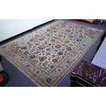 An Isfahan carpet, Persian, the ivory field with a small central roundel,
