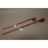 Two East African hardwood clubs, one with naturalistic root form head,
