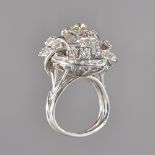 A diamond ring, in a raised cluster design,