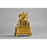A French Empire style gilt metal figural mantel clock, 19th century,