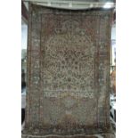 A Kashan Souf prayer rug, Persian, the ivory mihrab with a vase of abundantly floral sprays,
