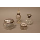 A small group of silver mounted glassware, comprising; a powder bowl, Birmingham 1921, a toilet jar,