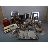 Silver plated wares, including; a pair of Christofle plated jugs, photo frames, cake stands, jugs,