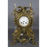 A Louis XV style gilt brass mantel clock, 40cm high.