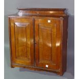 A small late 19th century walnut two door hanging cupboard, 50cm wide x 56cm high.