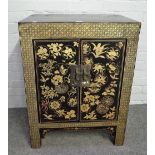 An early 20th century Chinese export chinoiserie decorated small two door side cabinet,