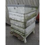 An early 20th century white painted bee hive, 50cm wide x 100cm high (weathered).