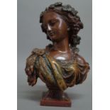 After Marin, a bronzed metal bust of a classical female, raised on a square foot, unsigned 18.