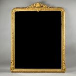 A large 19th century gilt framed overmantel mirror, with shell crest and egg and dart moulded frame,