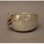 An Italian bowl, by Giovanni Raspini of circular form, with a climbing leopard motif to the side,