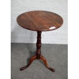 A mid-18th century oak circular snap top tripod occasional table, 45cm diameter x 70cm high.