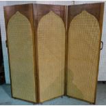 An early 20th century oak framed draught screen with arch top and canework panels,
