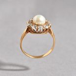A gold, diamond and cultured pearl cluster ring,