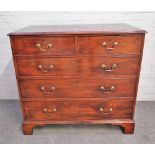 A George III mahogany chest of two short and three long graduated drawers on bracket feet,