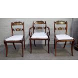 A Regency brass inlaid carver chair with tablet waist rail and sabre supports,