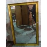 A 19th century gilt framed rectangular mirror, with moulded scroll decoration,