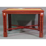 A 20th century red lacquer and faux shagreen rectangular coffee table on block supports,