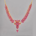 A gold and ruby necklace, the front with a central foliate cluster, between tapered foliate sides,