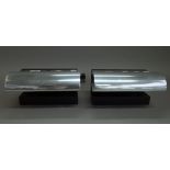 A pair of contemporary chromed metal and ebonised wood desk lights of plain angular form, unsigned,