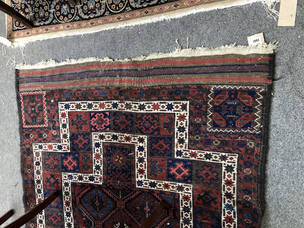 A Persian tribal rug with multicoloured repeating gul design within stepped white borders, - Image 4 of 7