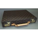 A Louis Vuitton briefcase with monogrammed canvas and brass hardware, 43cm wide x 32cm x 7.5cm.