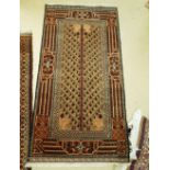 Two small rugs with brown fields, the first with peacocks and hares,
