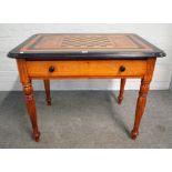 A 19th century Anglo-Indian ebony and satinwood games table with chess board inlaid top and single